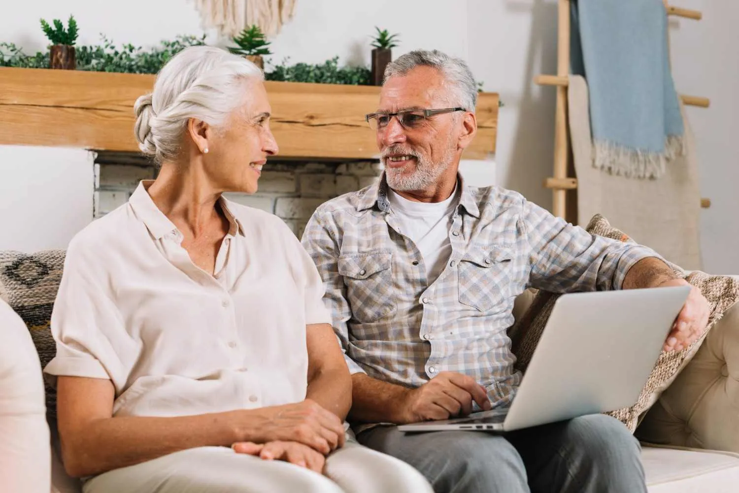 An older couple reviewing Medicare plan details together at home